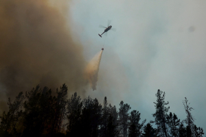 Helicopter putting out fire