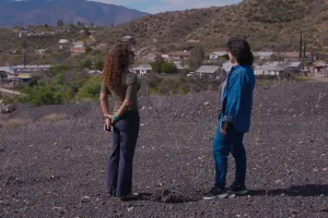 two people talking in a empty lot