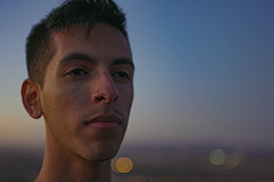 man looking out in sunset