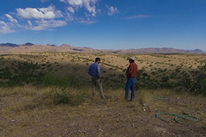 two men standing on a field in Southern arizona