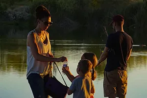 family by lake